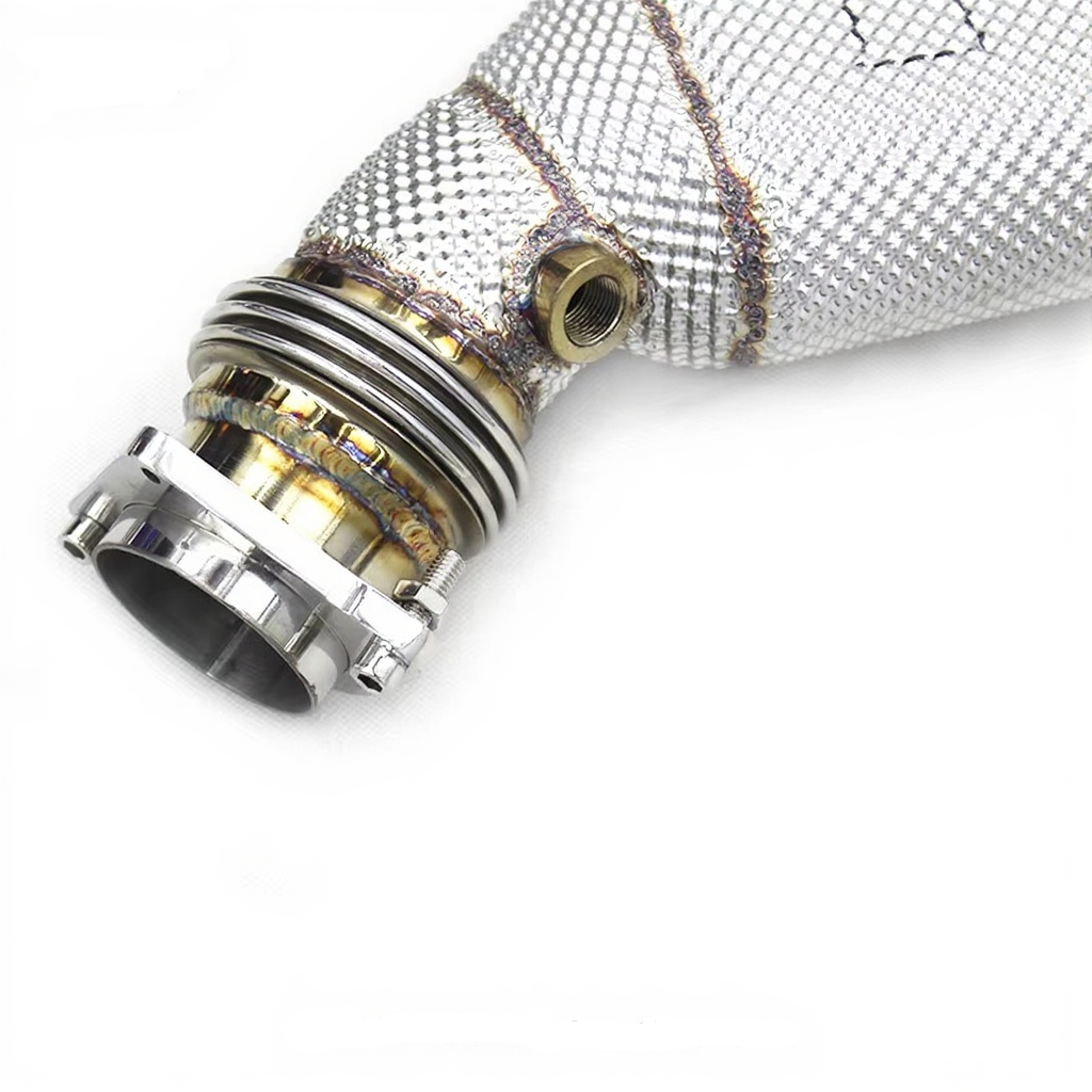 Close-up of a BMW M3 M4 F82 exhaust downpipe with metallic finish on a white background.