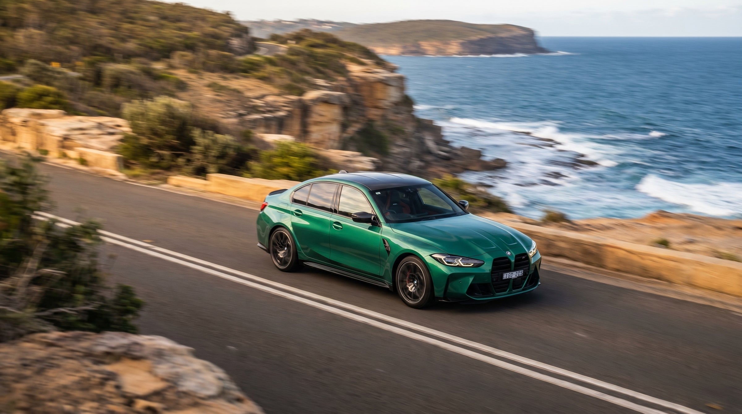BMW M3 G80 Isle of Man Green rolling coastal road