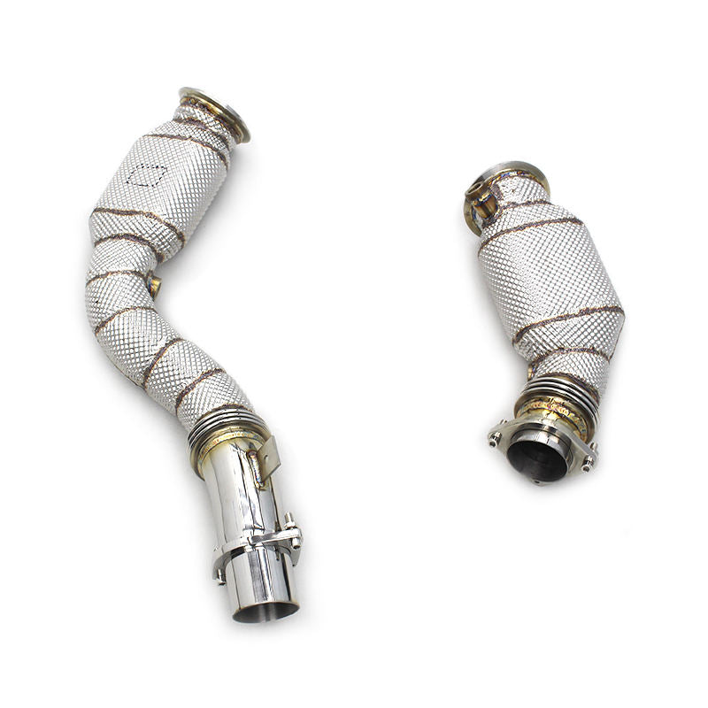 Two metallic exhaust pipes with woven metal sleeves on a white background