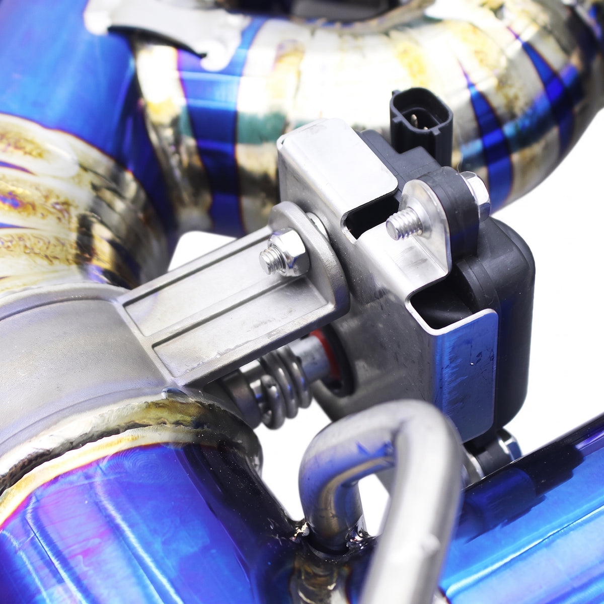 WSTN Performance Audi RS3 8V DAZA/DNWA titanium valved catback exhaust, close-up of an electronic valve actuator
